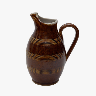 antique brown pitcher with raised dots