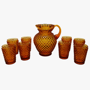 deep amber hobnail pitcher and glasses