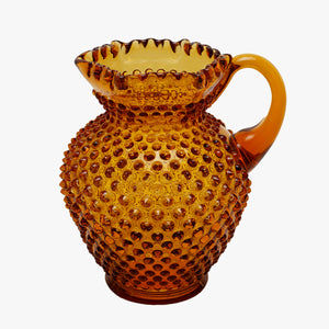deep amber hobnail pitcher and glasses